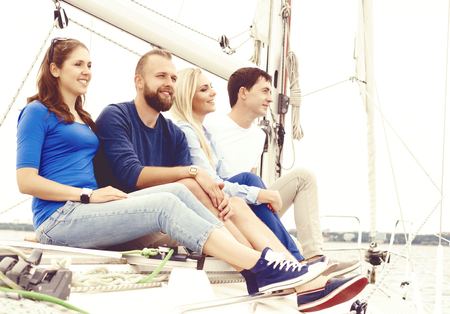 People traveling a yacht and enjoying a day. Summer, holiday, vacation concept.の写真素材