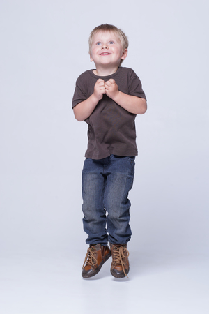 Studio portrait of a cute smiling boy. Happy child.の写真素材