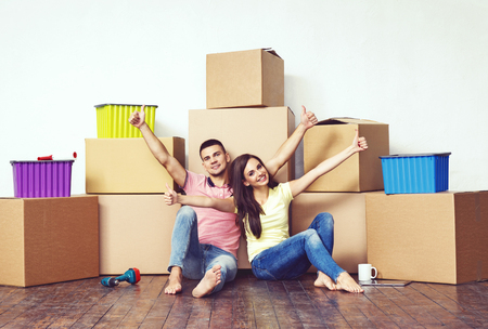 Young loving couple moving to a new house. Home and family concept.の写真素材