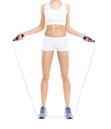Sporty and beautiful body of young and fit woman isolated on whiteの写真素材