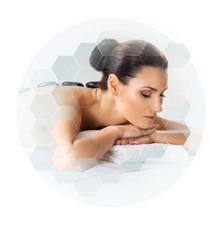 Young and beautiful woman in spa. Collage with honeycomb tiles. Healing and massaging concept.の写真素材