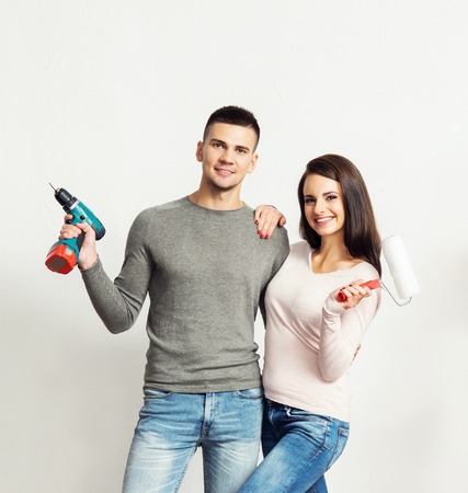 Young loving couple moving to a new house. Home and family concept.の写真素材