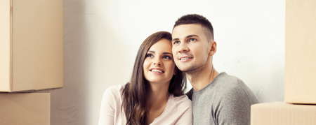 Young loving couple moving to a new house. Home and family concept.の写真素材