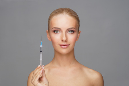 Beauty injection in a face of a young woman. Plastic surgery concept.の写真素材