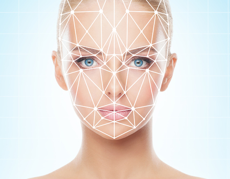 Portrait of beautiful girl with a scnanning grid on her face. Woman with face id scanner. Biometric verification, security, facial recognition, future technology.の写真素材