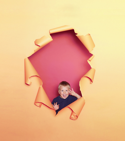 Studio portrait of a cute smiling boy. Happy child.の写真素材