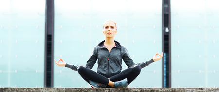 Young, fit and sporty brunette girl in sportswear. Woman doing sports outdoor.の写真素材