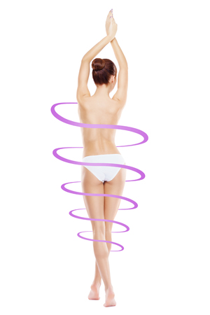 Fit and slender woman in swimsuit. Perfect female shape. Medicine, weight loss, fat burn and healthcare.の写真素材