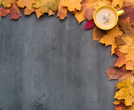 Seasonal autumn background. Frame of colorful maple leaves.