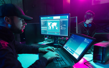 Wanted hackers coding virus ransomware using laptops and computers in the basement. Cyber attack,...