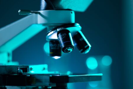 Close-up of scientific microscope. Laboratory in hospital. Epidemic disease, healthcare, vaccine research and coronavirus covid-19 test.の写真素材