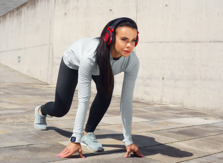 Young and sporty brunette woman training outdoor. Fitness, sport, lifestyle and health care.
