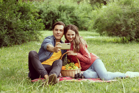 Young, happy, loving couple having date in the park. Relations, friendship and love.