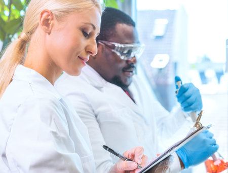Scientist working in lab. Doctors making medical research. Laboratory tools: microscope, test tubes,...