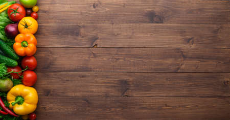 Healthy eating ingredients: fresh vegetables, fruits and superfood. Wooden backgroundの写真素材