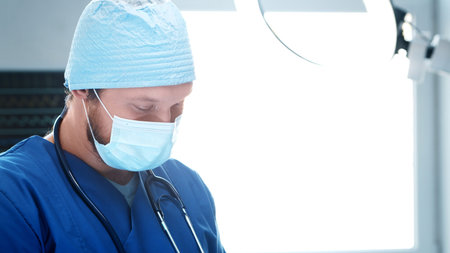 Professional medical doctor working in emergency medicine. Portrait of the surgeon in protective...
