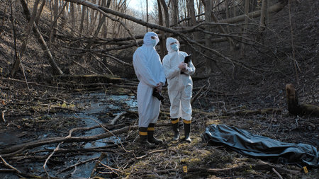 Detectives are collecting evidence in a crime scene. Forensic specialists are making expertise....