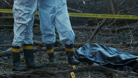 Detectives are collecting evidence in a crime scene. Forensic specialists are making expertise....