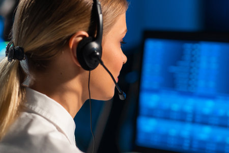 Female broker is workin in office using workstation and analysis technology. Workplace of professional trader. Global financial markets, business strategy, currency exchange and banking.の写真素材