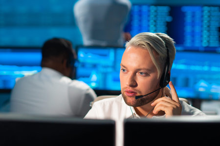 Team of brokers is working in office using workstation and analysis technology. Workplace of...