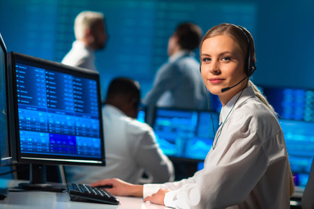 Diverse team of brokers workin in office using workstation and analysis technology. Workplace of...