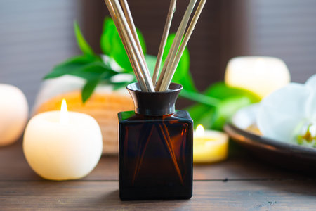 Spa background. Towel, candles, aroma sticks, orchid flowers and herbal balls. Massage, oriental...