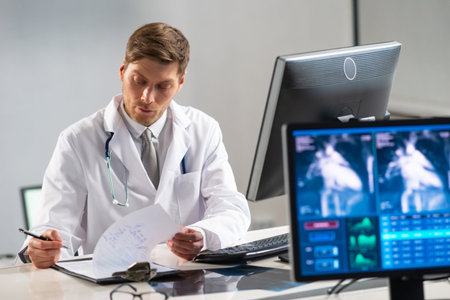 Professional medical doctor working in hospital office using computer technology. Medicine,...