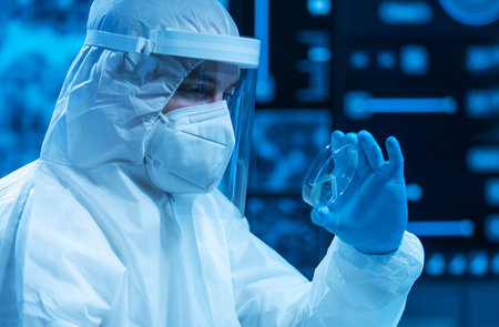 Scientist works in a modern scientific lab using laboratory equipment, microscope and computer...