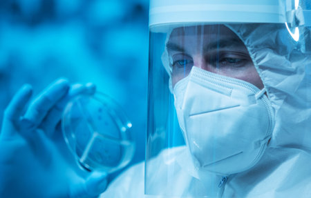 Scientist works in a modern scientific lab using laboratory equipment, microscope and computer...