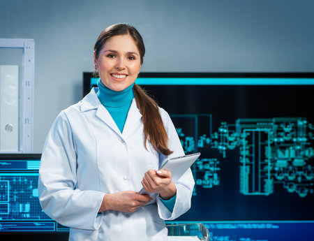 Workplace of young woman in modern microelectronics manufacturing lab. Engineer works in a modern...