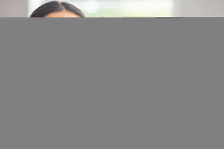 Diverse team of young professionals is working in the phone support office. Working day of sales managers in the call center. Business, telephone consulting and problem solving.の写真素材