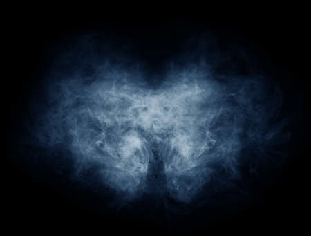 Smoke over black background. Fog or steam texture.の写真素材