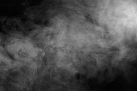 Abstract smoke texture over black. Fog in the darkness.の写真素材