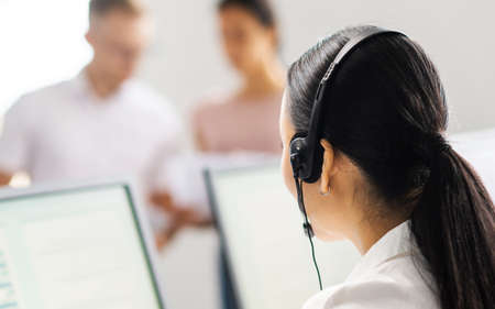 Team of professional support staff working in the office. Colleagues in the workplace solve customer problems. Call center and customer support concept.の写真素材