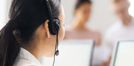 Team of professional support staff working in the office. Colleagues in the workplace solve customer problems. Call center and customer support concept.の販売画像
