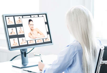 Young Woman Works at Home Office Using Computer. Workplace of Female Entrepreneur, Freelancer or Student. Remote Work and Education Concept.の写真素材