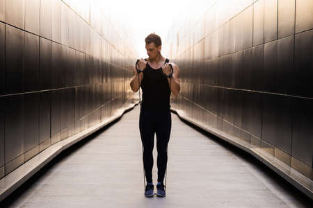 Young Muscular Man Doing Sports Outside at Sunset. Training of a Young Strong Athlete. Fitness and Healthy Lifestyle Concept.の写真素材