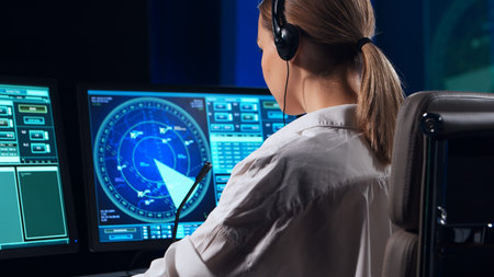 Workplace of the air traffic controllers in the control tower. Team of professional aircraft control...