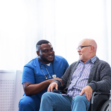 Professional doctor helps an elderly man with chronic diseases. Therapist and patient in home interior. Health care and medicine concept.の写真素材