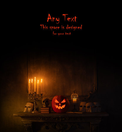 Halloween background with copy space for any text. Scary pumpkin and old skull on ancient gothic fireplace. Halloween, witchcraft and magic.の写真素材