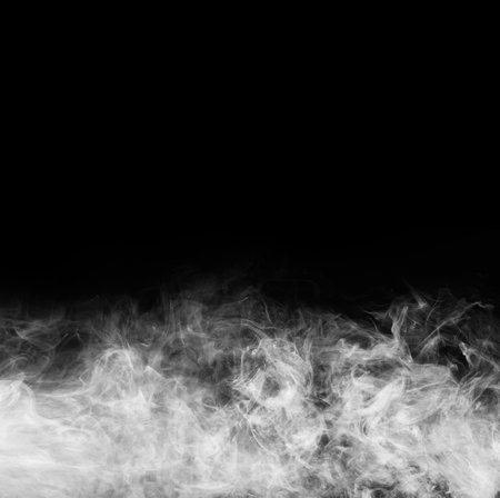 Smoke over black background. Fog or steam abstract texture.の写真素材