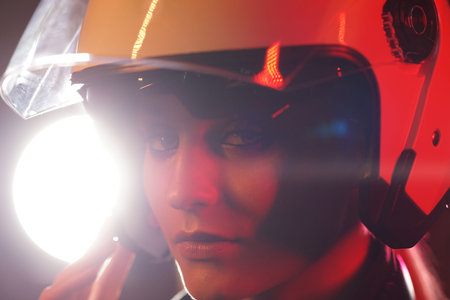 Portrait of a beautiful and young girl in cyberpunk style. Mixed color light effect. Futuristic...