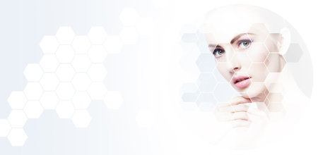 Portrait of healthy and beautiful woman. Female face in honeycomb texture. Young girl in plastic surgery, medicine, spa and face lifting concept.の写真素材