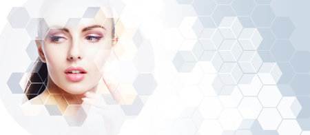 Portrait of healthy and beautiful woman. Female face in honeycomb texture. Young girl in plastic surgery, medicine, spa and face lifting concept.の写真素材