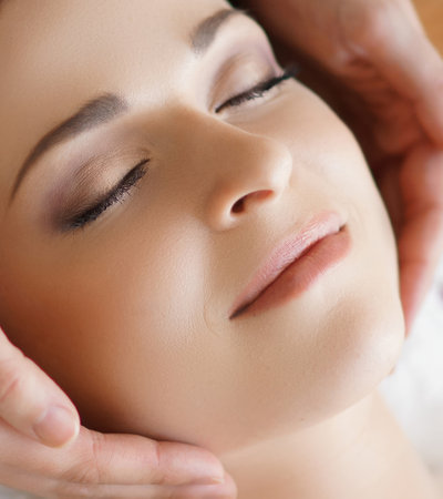 Young and healthy woman in spa isolated on whiteの写真素材