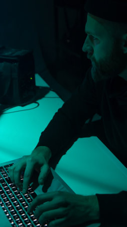 Internet fraud, darknet, data thiefs, cybergrime concept. Hacker attack on government server. Dangerous criminals coding virus programs.の写真素材