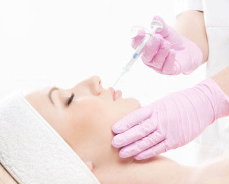 Young beautiful woman getting spa and beauty treatment. Rejuvenation and health care.の写真素材