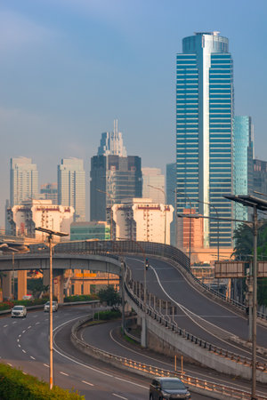 urban traffic with modern building background in Jakarta, Indonesiaの写真素材
