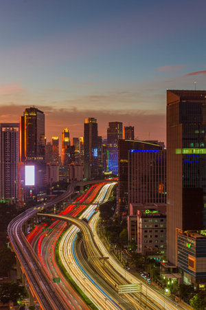 Jakarta cityscape at twilight with traffic light trails, Indonesia