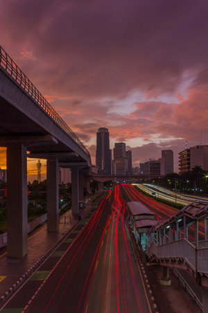 Traffic on the road in the city at sunset, Bangkok, Thailandの写真素材